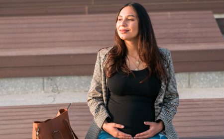 Urban portrait of a modern pregnant latina woman.